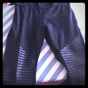 Black leggings with leather design
